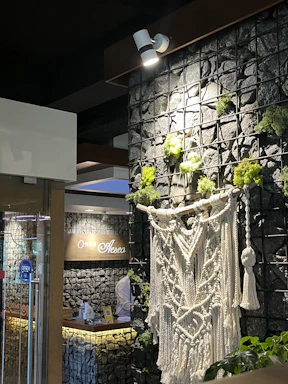 A welcoming office entrance with warm earthy tones and a clear sign displaying 'kashivastra'.