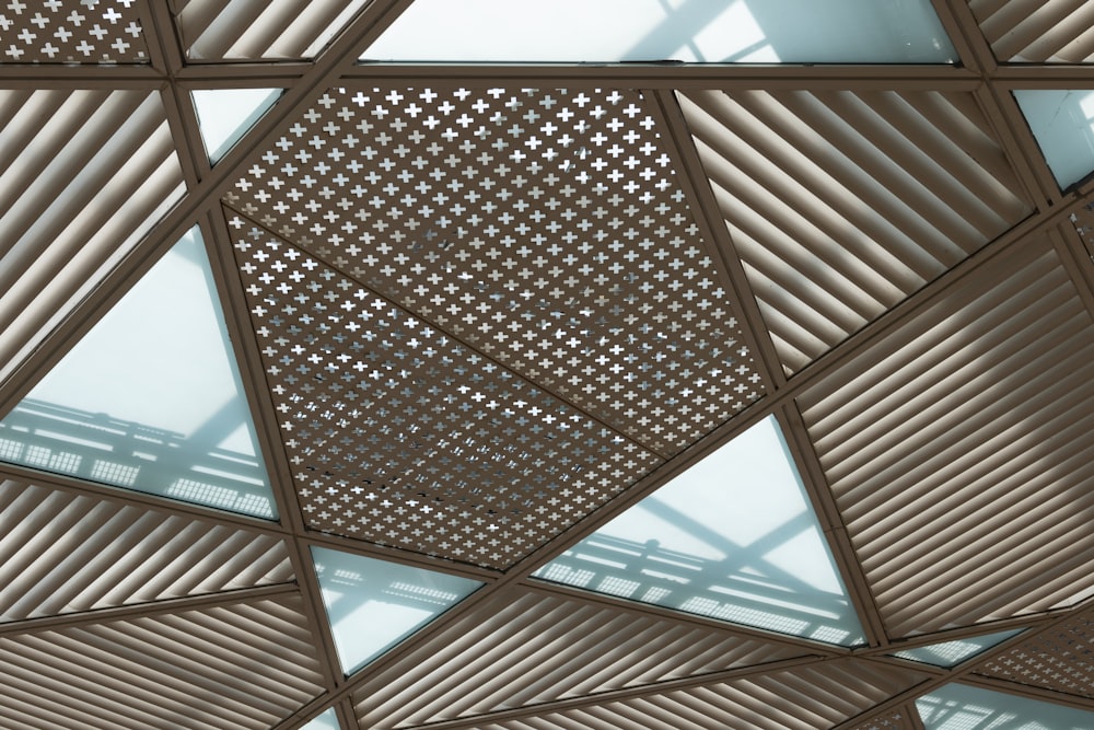a close up of a metal structure with a skylight
