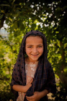 A beautiful Uzbek girl enjoying a sunny day in a picturesque location.