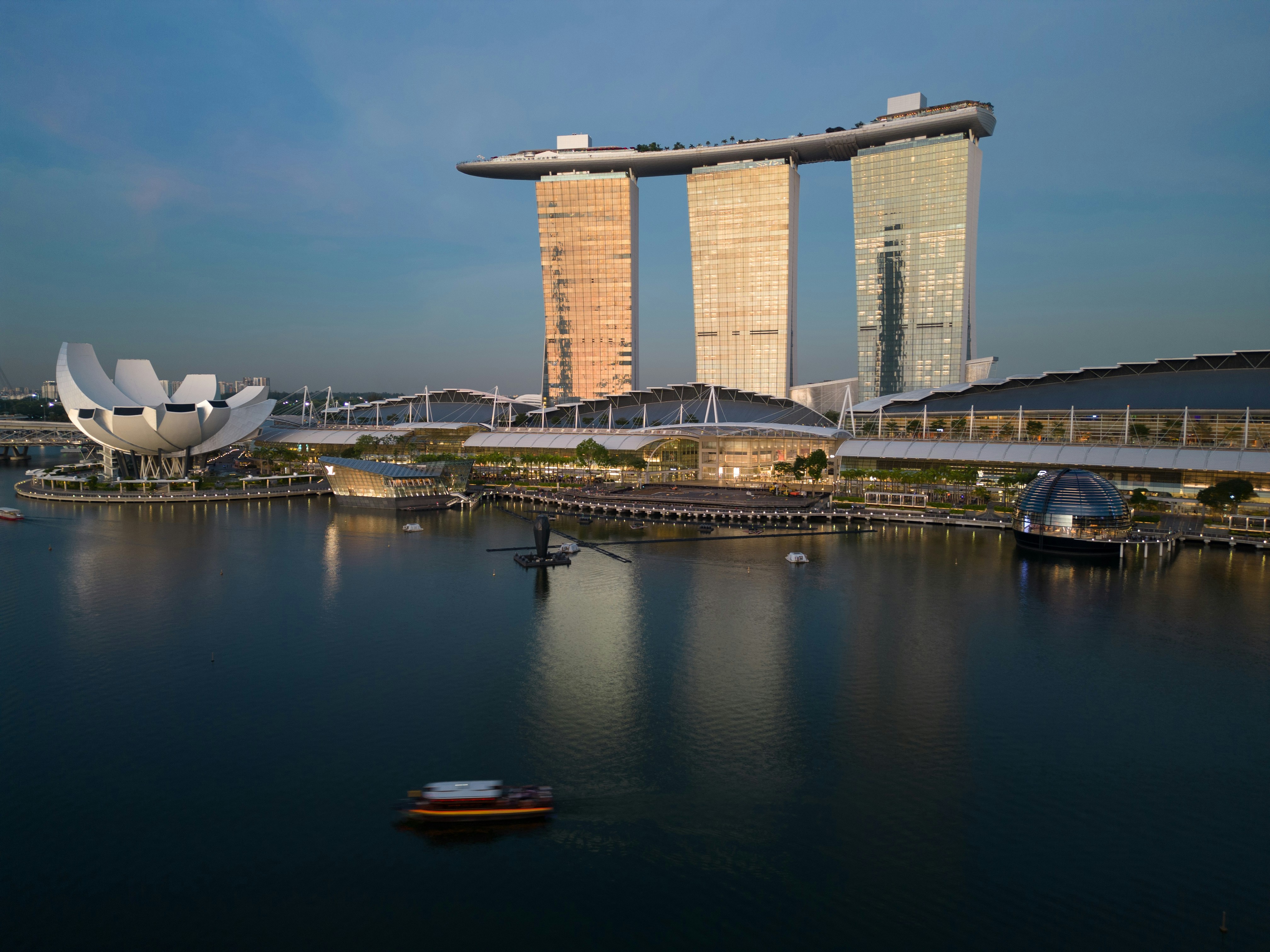 a body of water with a boat in the middle of it