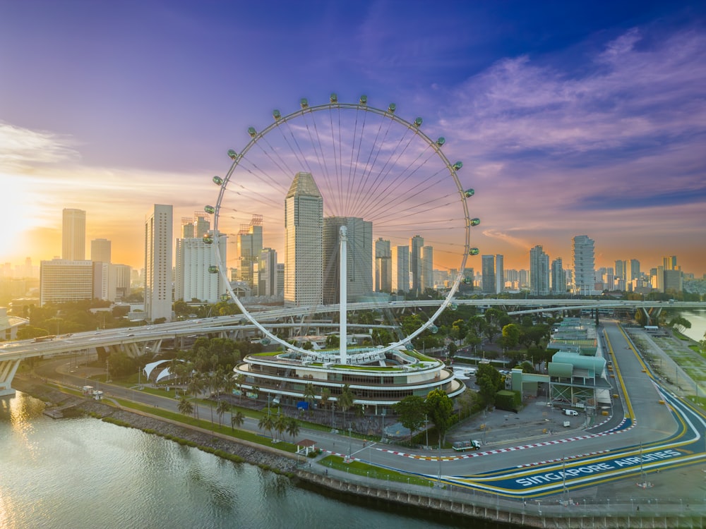 an aerial view of a city with a ferris wheel