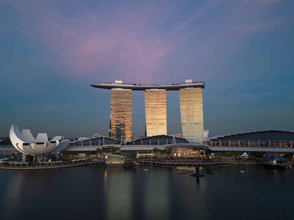 a large body of water in front of a tall building