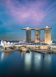a large body of water with a bunch of tall buildings in the background