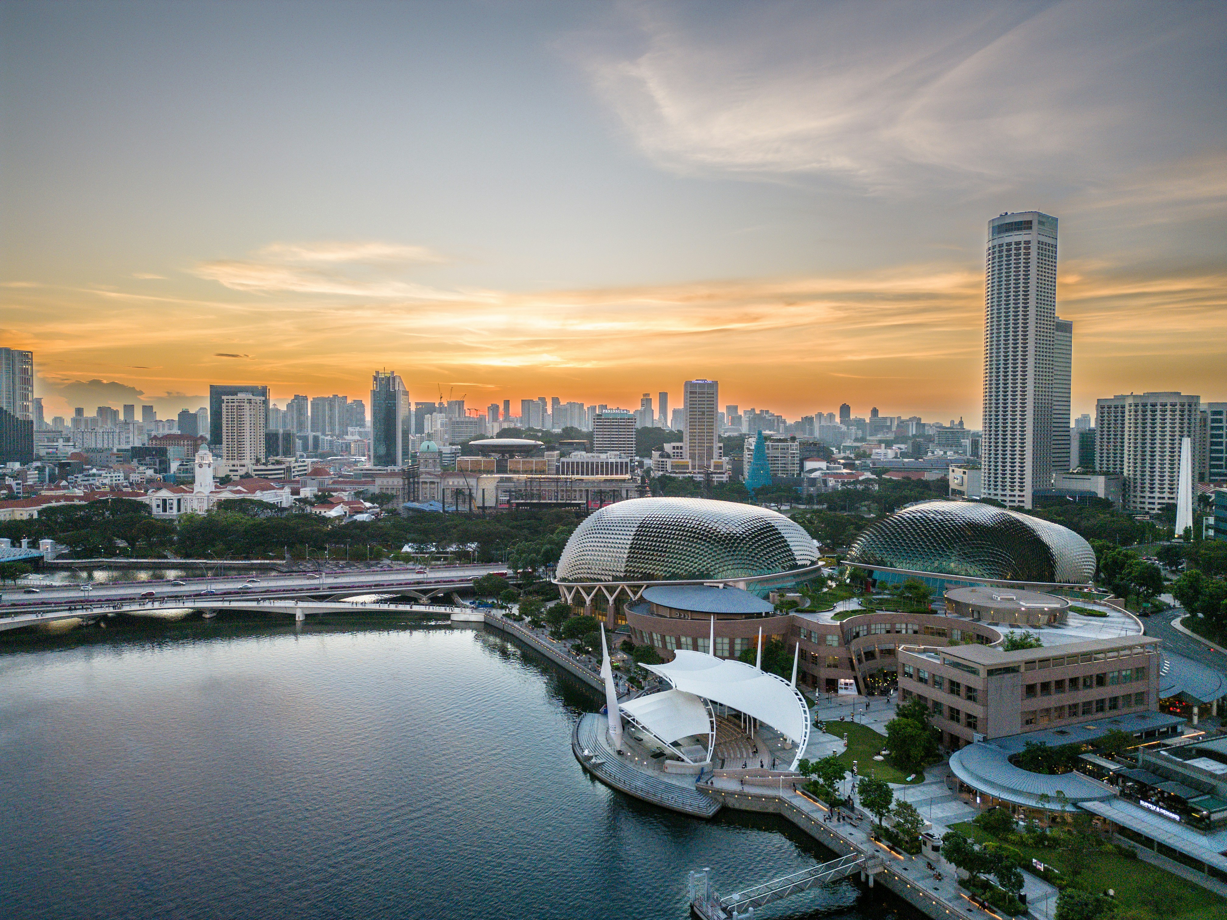 an aerial view of a city and a body of water