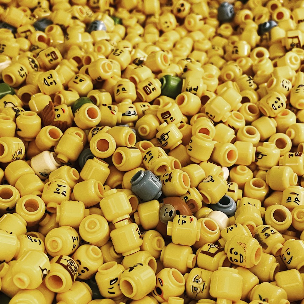 a pile of yellow and green ceramic beads