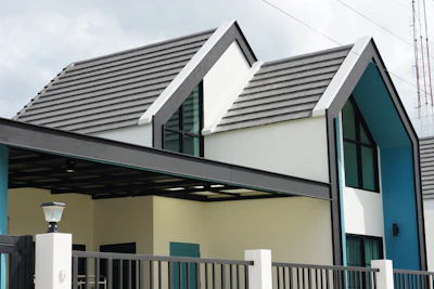 Elegant home exterior showcasing a sleek, high-end roof with rich textures and colors.