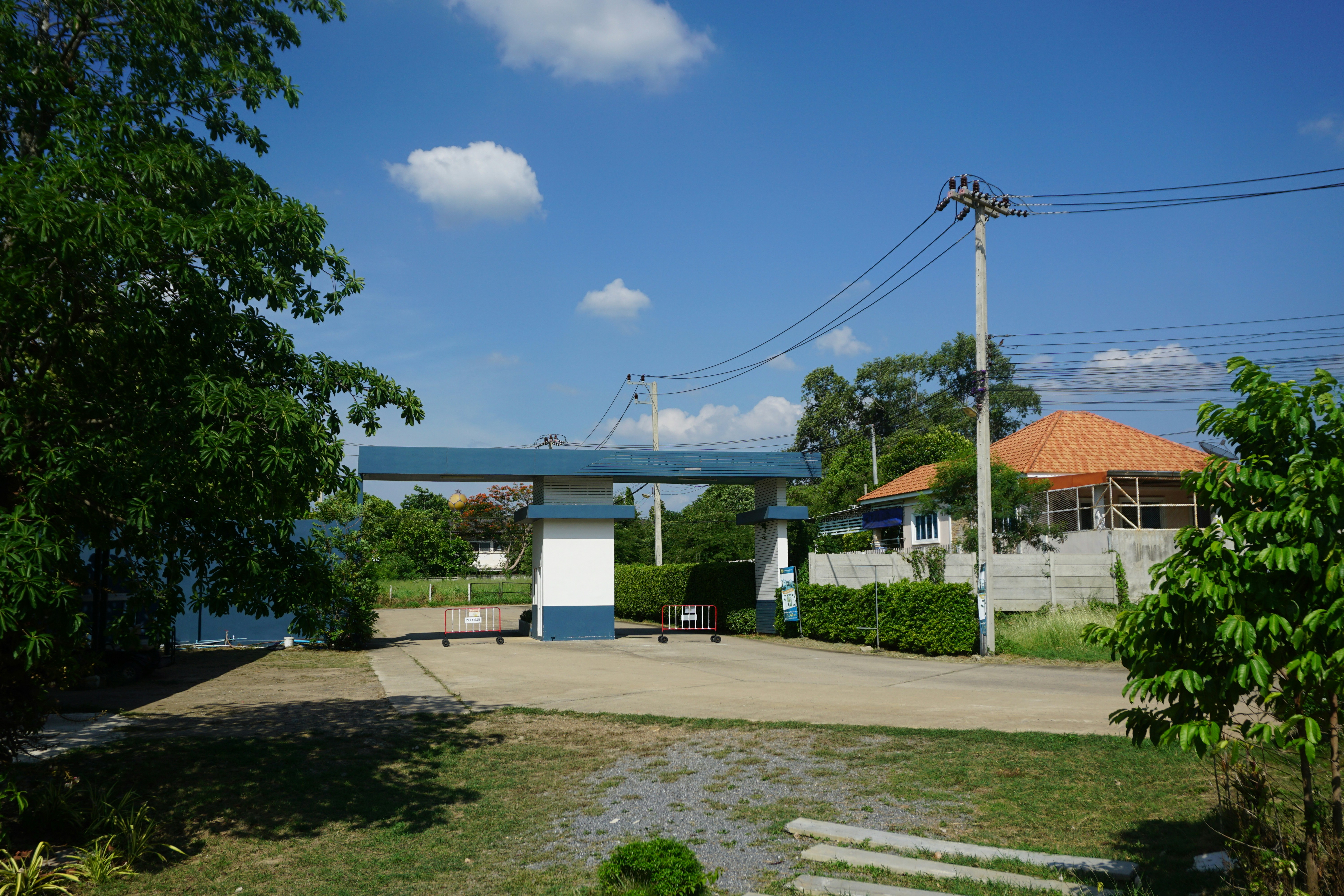 a blue and white building with a blue roof