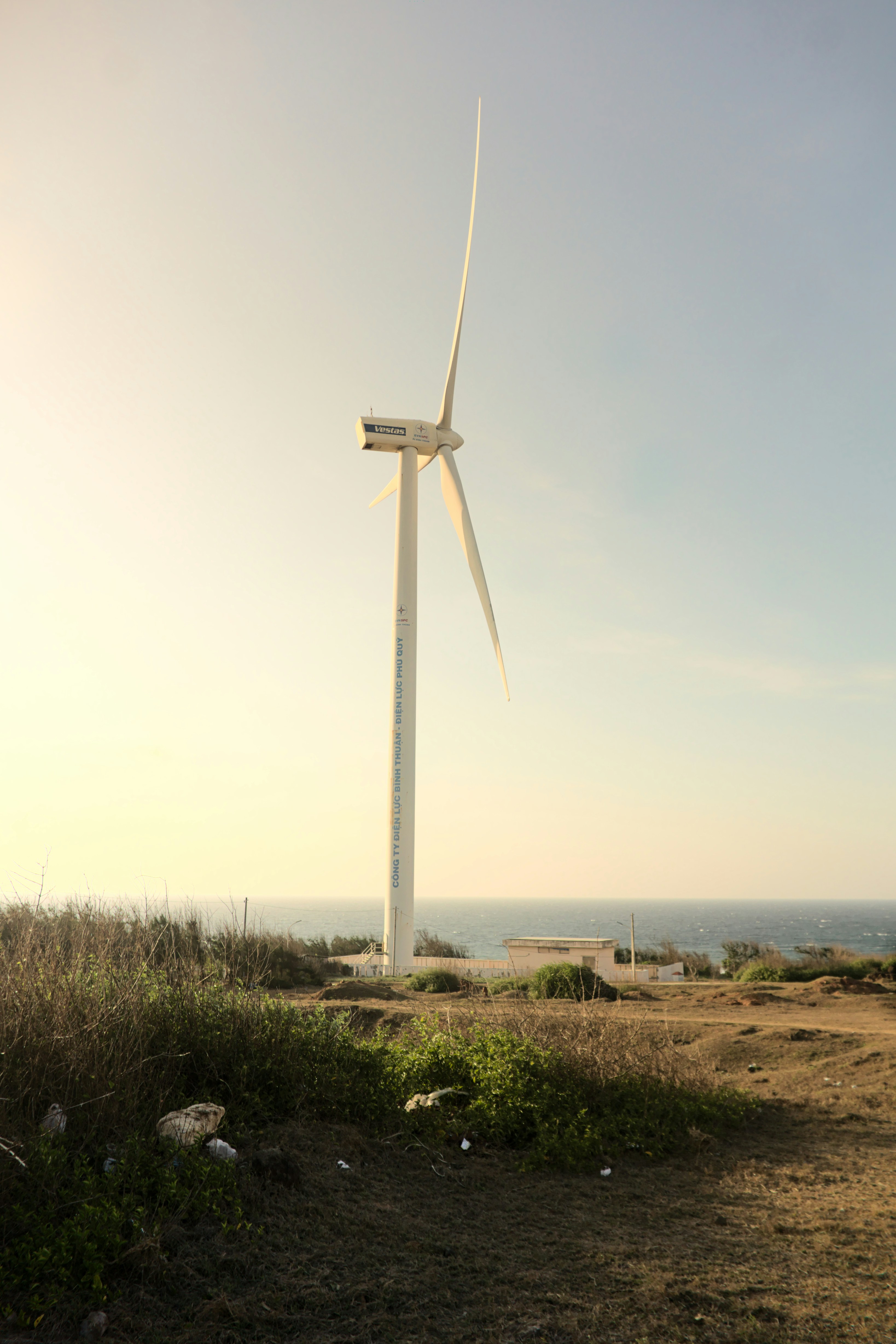 A wind turbine in the middle of a field photo – Free Phú quý Image on ...