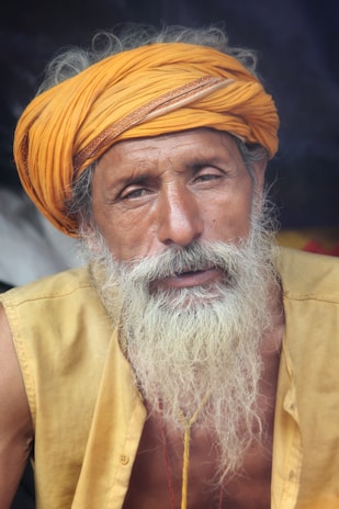 Portrait of Pandit Sunil Bharadwaj in traditional attire, radiating calm and wisdom.