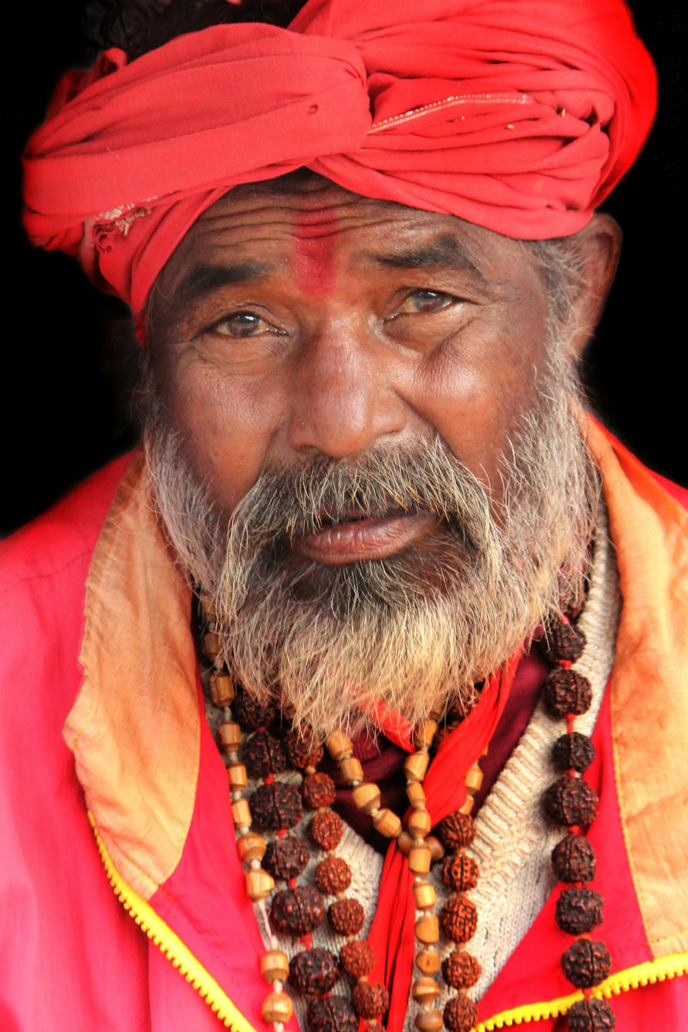 a man with a red turban on his head