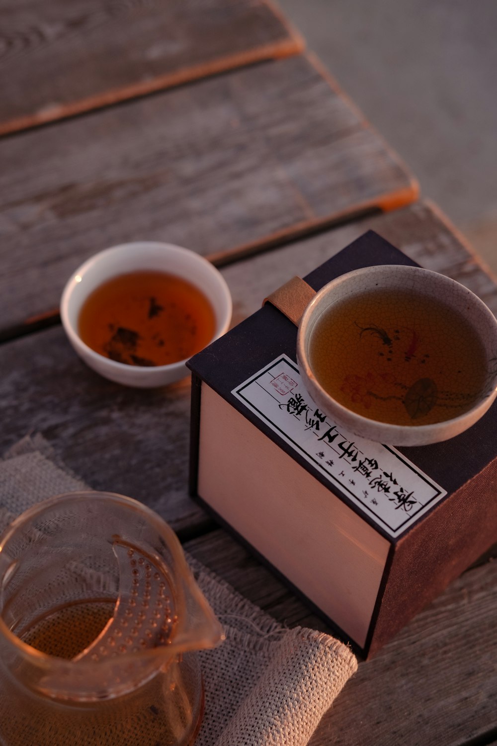a cup of tea and a tea box on a table