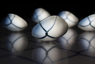 Close-up of translucent spheres with light reflections evoking clarity and ideas.