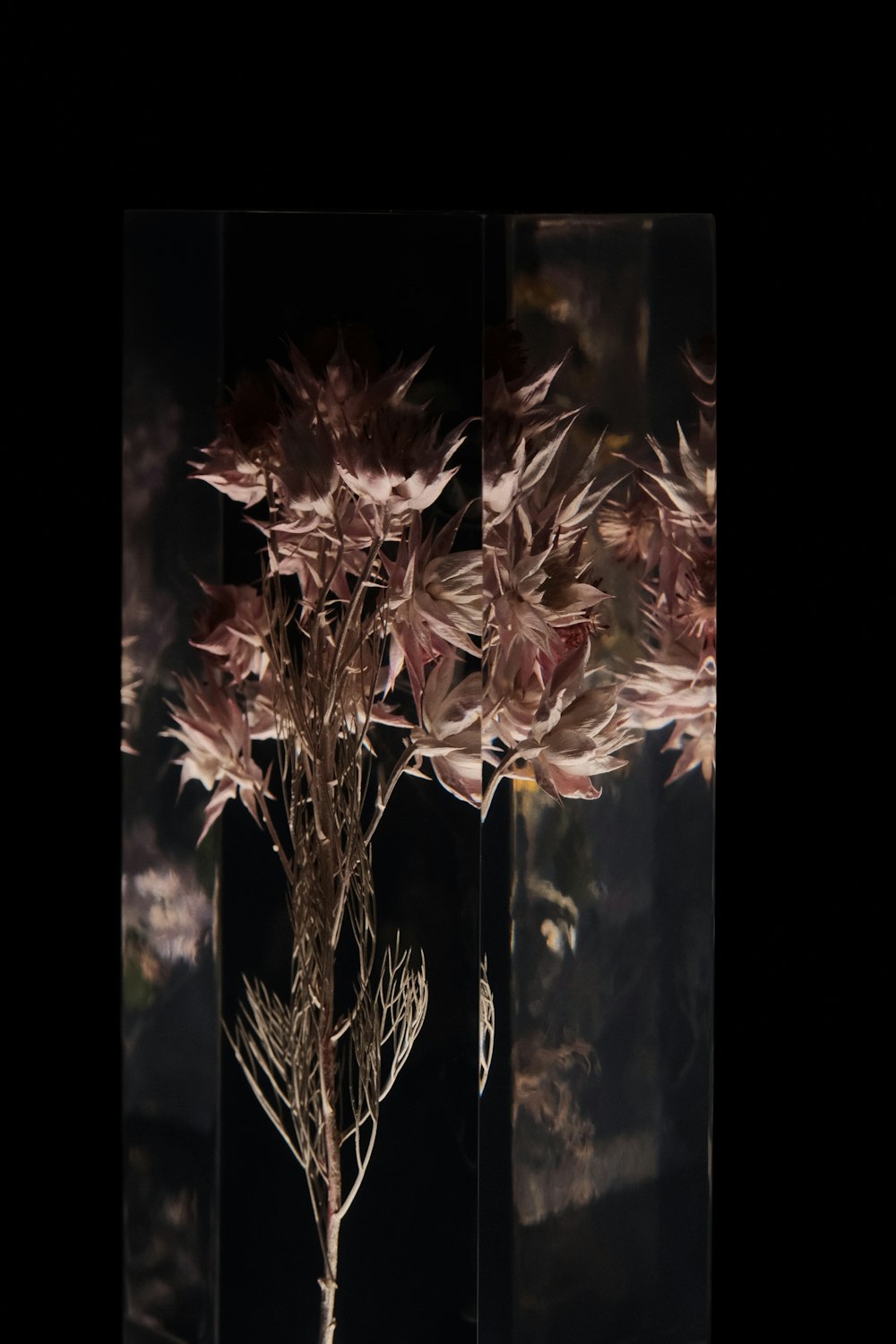 a vase filled with flowers sitting on top of a table