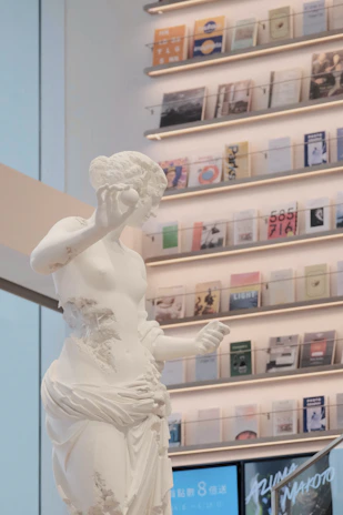 Elegant office interior with legal books and a subtle statue of the goddess of justice on the desk.