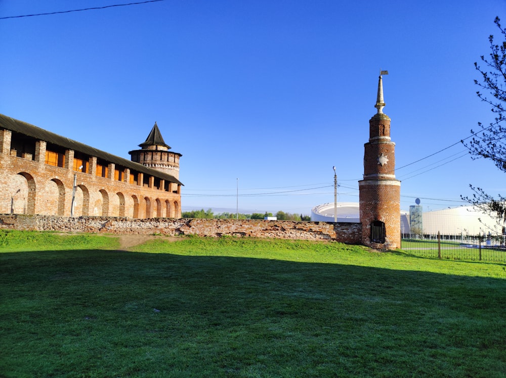 an old brick building with a clock tower in the background