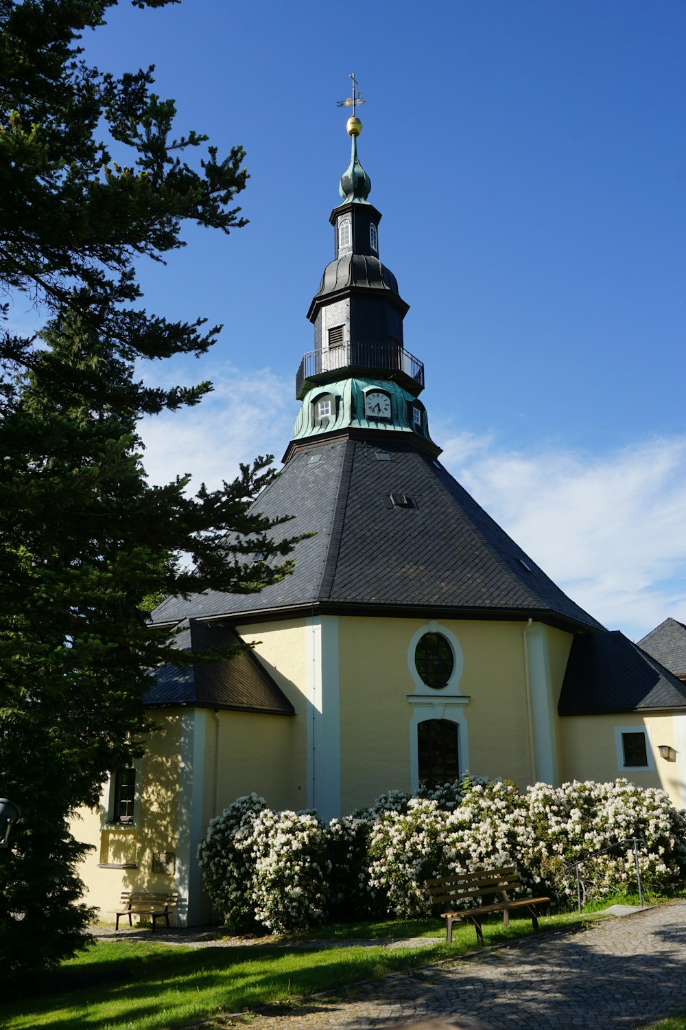 a church with a steeple and a clock tower