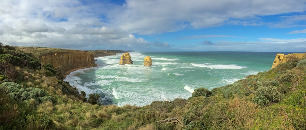 a scenic view of the ocean and cliffs