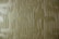 A textured surface featuring a geometric pattern of vertical and horizontal lines in a relief style. The pattern creates a three-dimensional effect with shadows enhancing the depth.