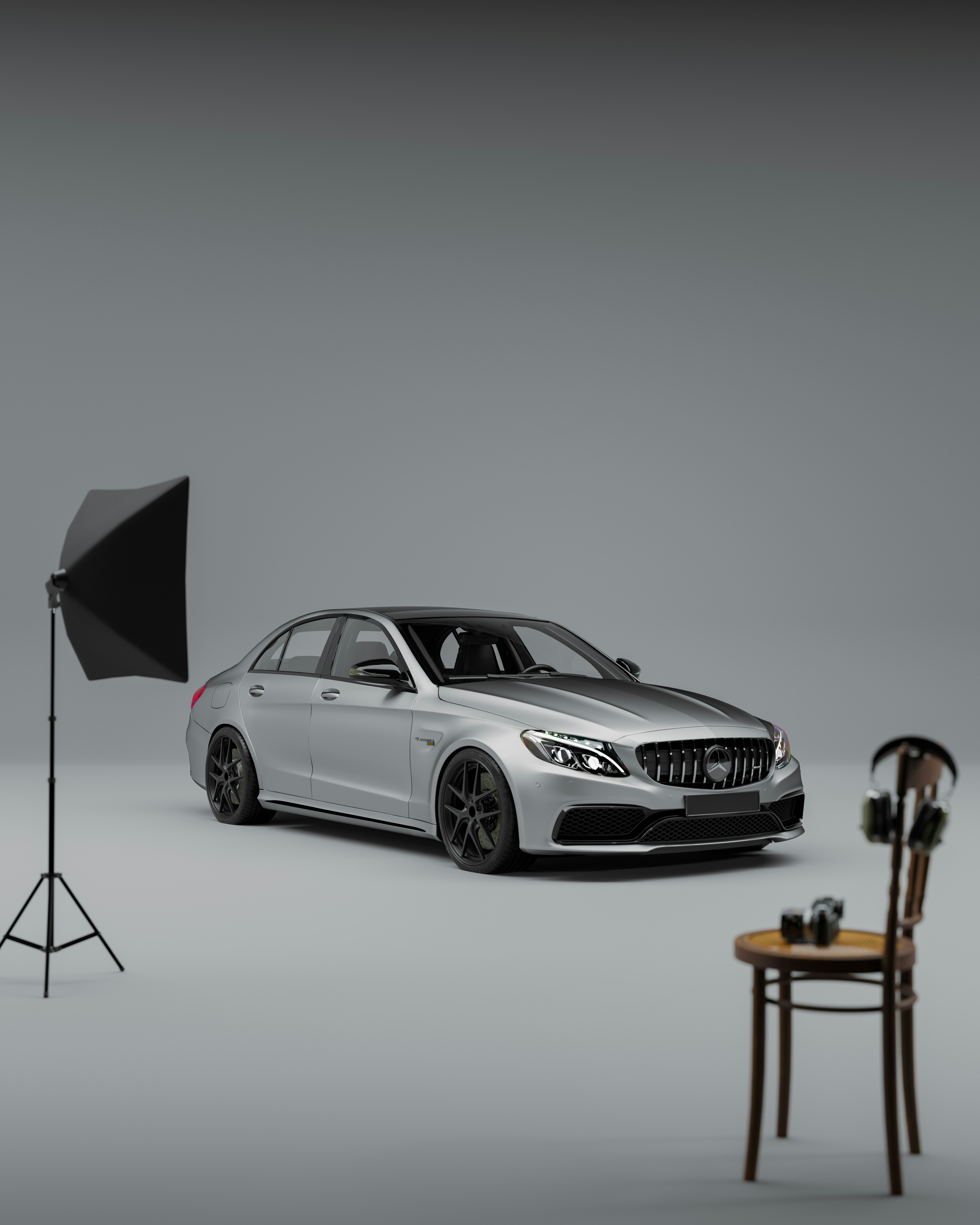 a car is parked in front of a camera and a chair