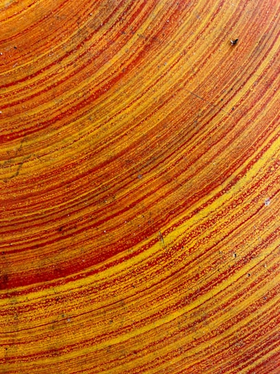 Close-up of a colorful epoxy resin art piece with swirling patterns.