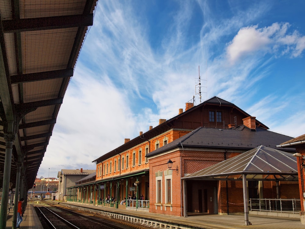 a train station with a train on the tracks