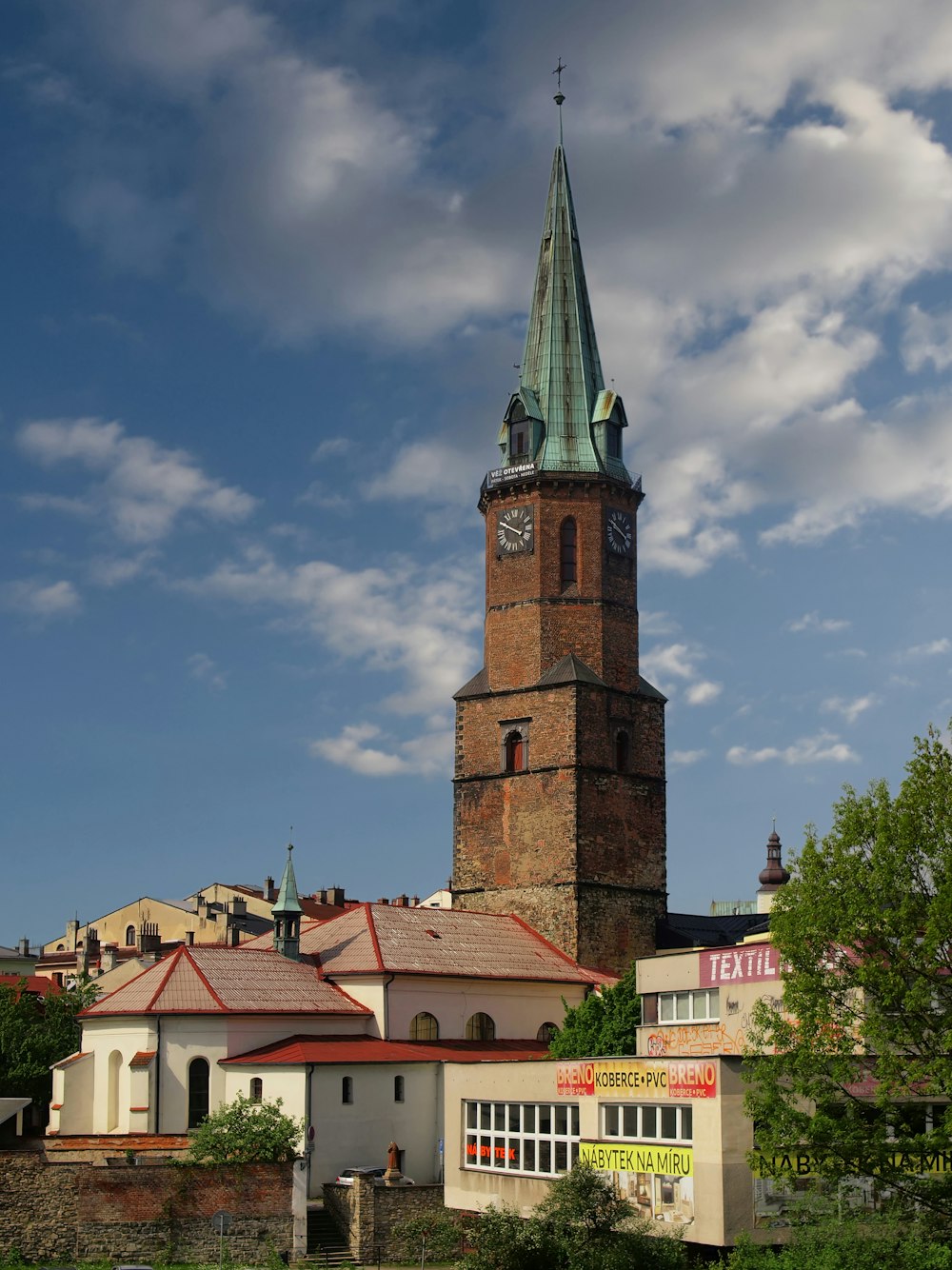 a tall clock tower towering over a city