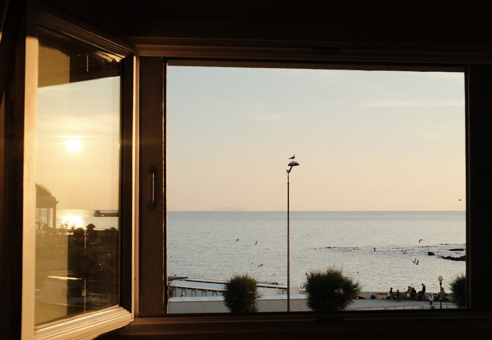 a view of the ocean out of a window