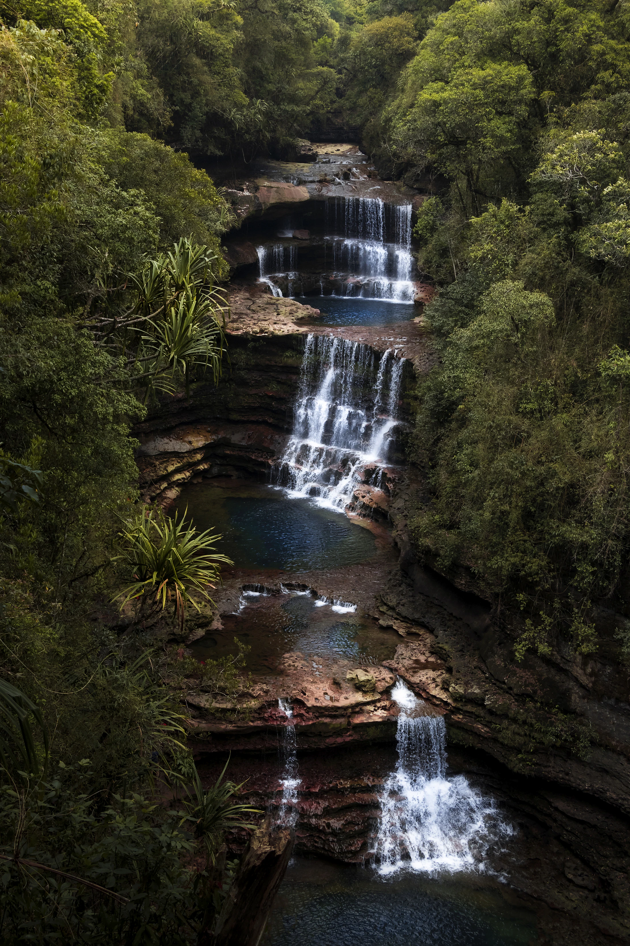 The three tiers of Wei Sawdong falls in the forest near Sohra