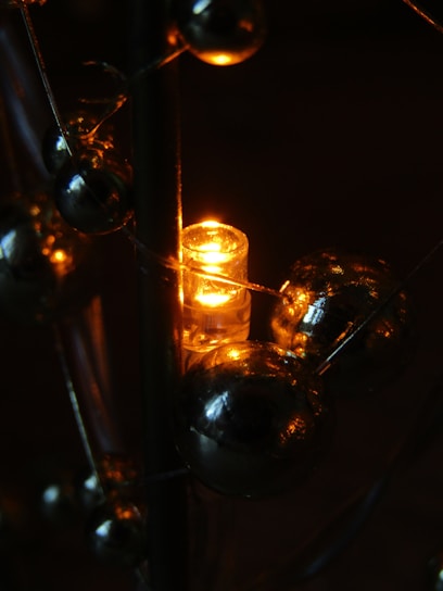 Close-up of vibrant 3D printed decorative items glowing under soft orange light