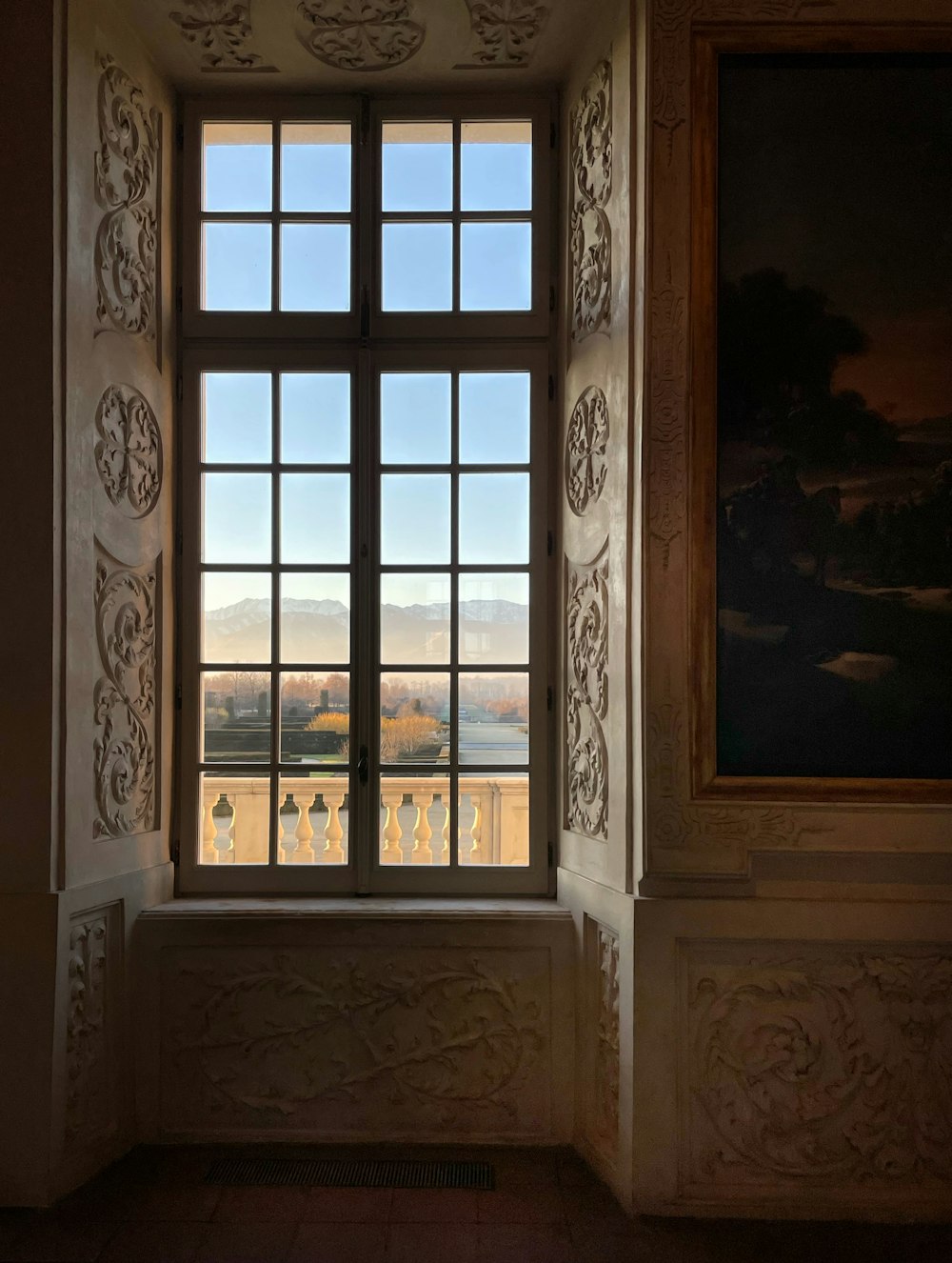 a window in a building with a view of a field