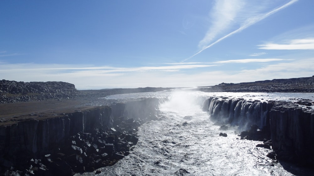 a large body of water surrounded by rocks