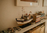 Detailed shot of maritime law books stacked next to a model ship