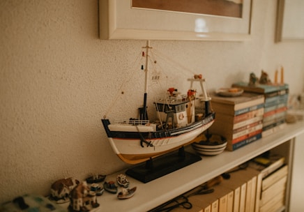 A variety of custom-designed house vessels displayed on wooden shelves.