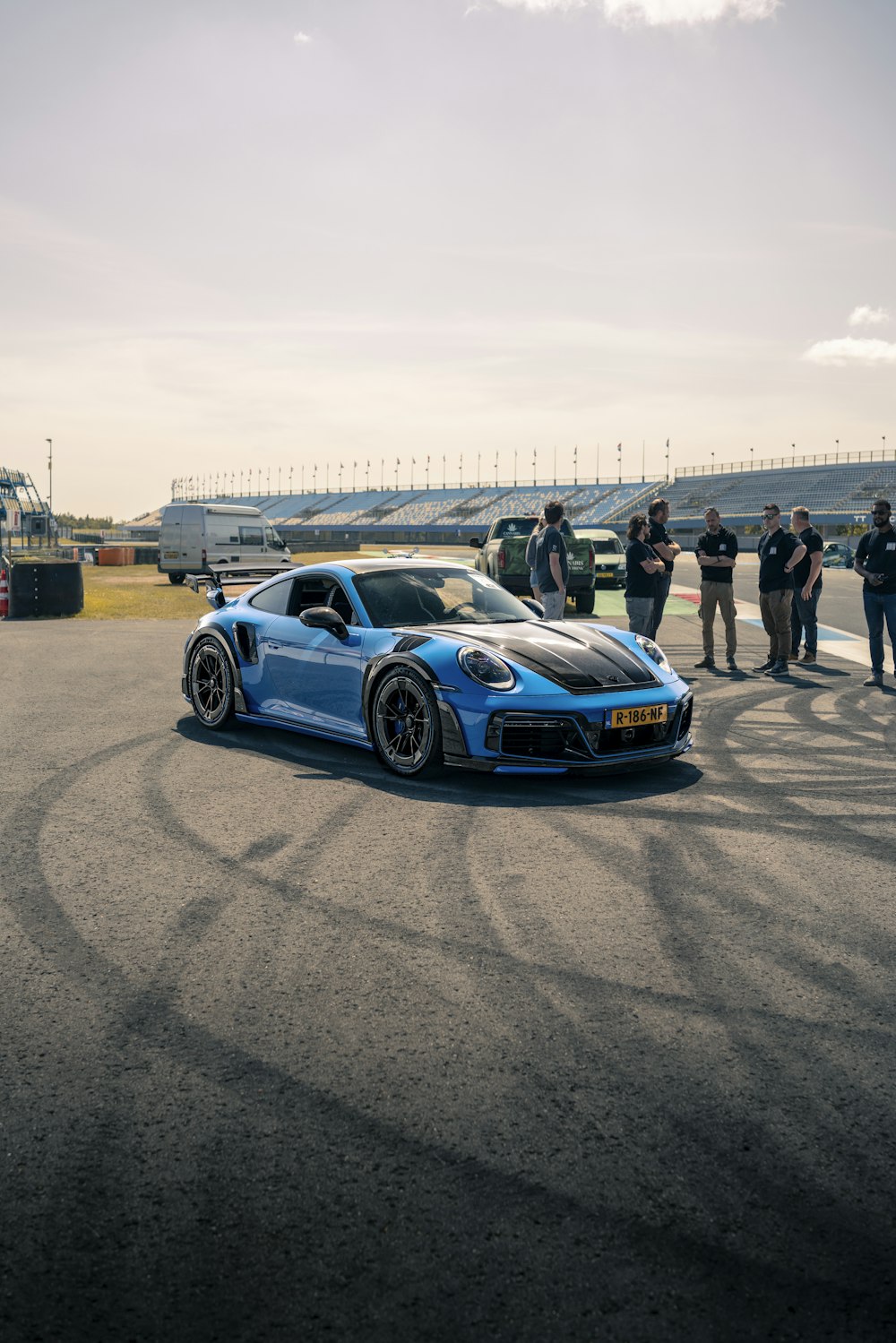 a blue sports car on a race track