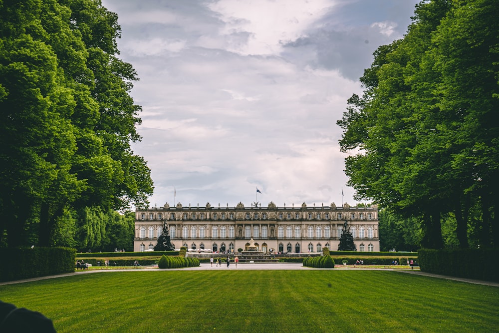 a large building with a lawn in front of it