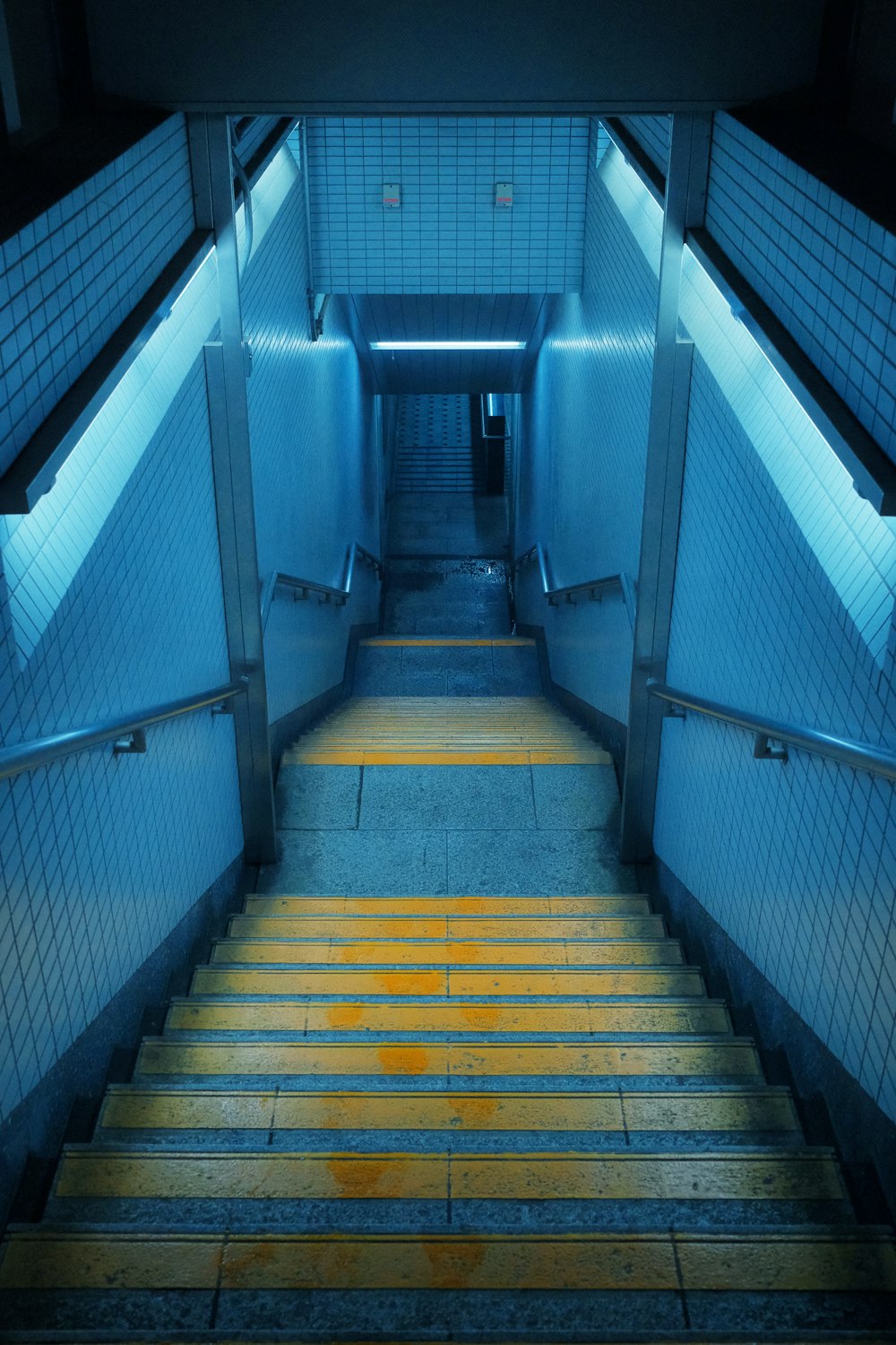 a set of stairs leading up to a tunnel