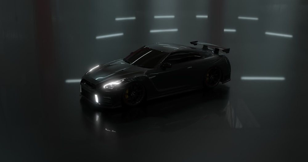 a black sports car in a dimly lit room