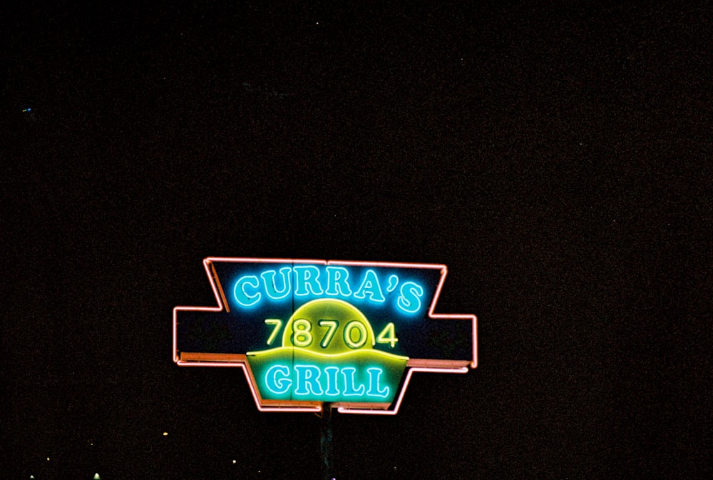 a neon sign for a restaurant called curra's bbq grill