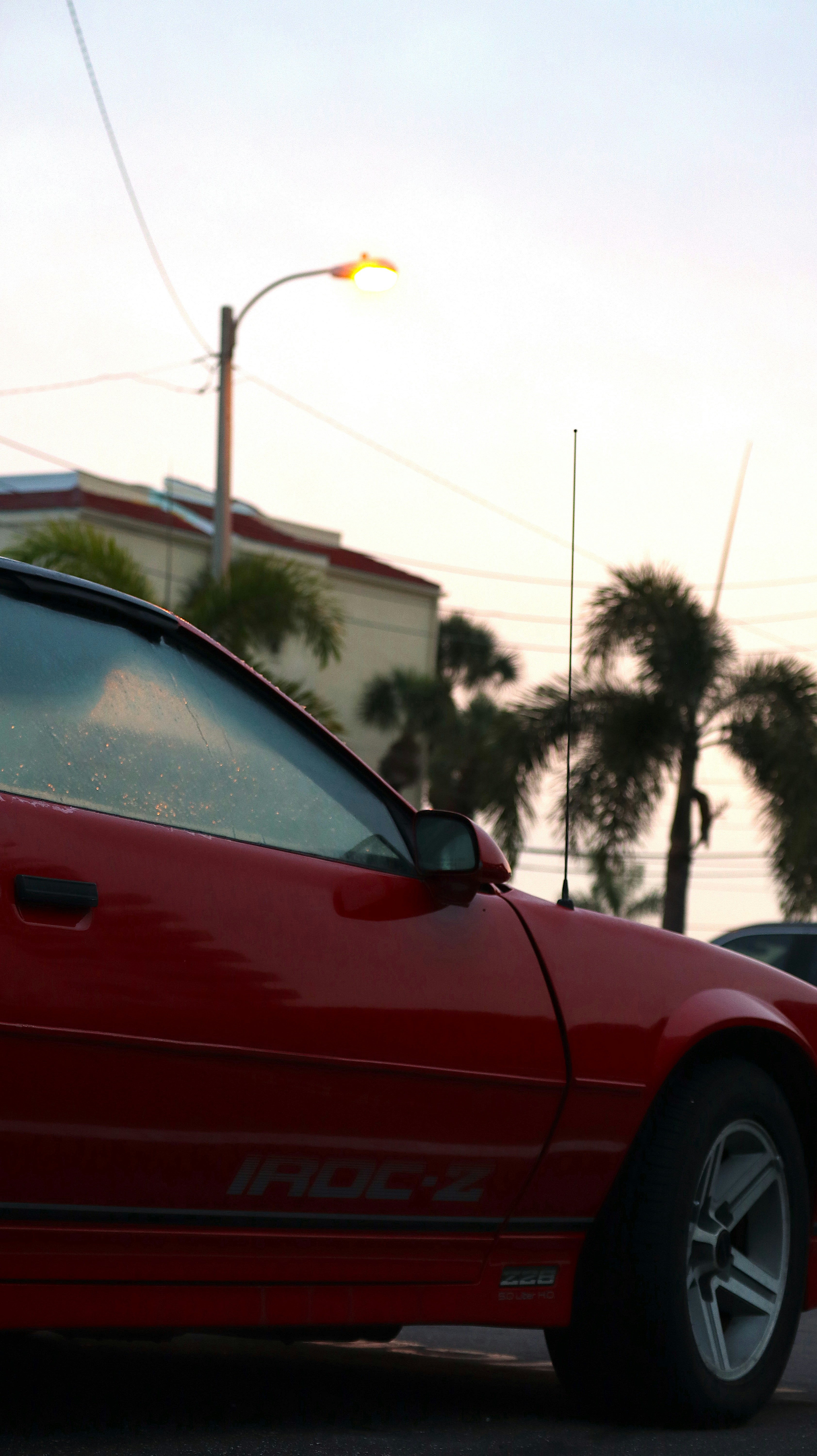 a red sports car parked on the side of the road