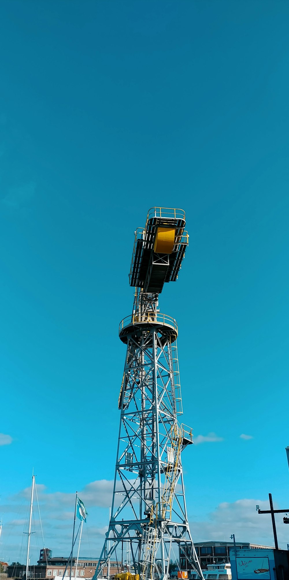 a tall tower sitting on top of a lush green field