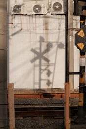 Warm-toned image of a digital safety signage display in an industrial facility.