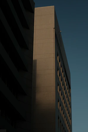 a tall building with a clock on the side of it