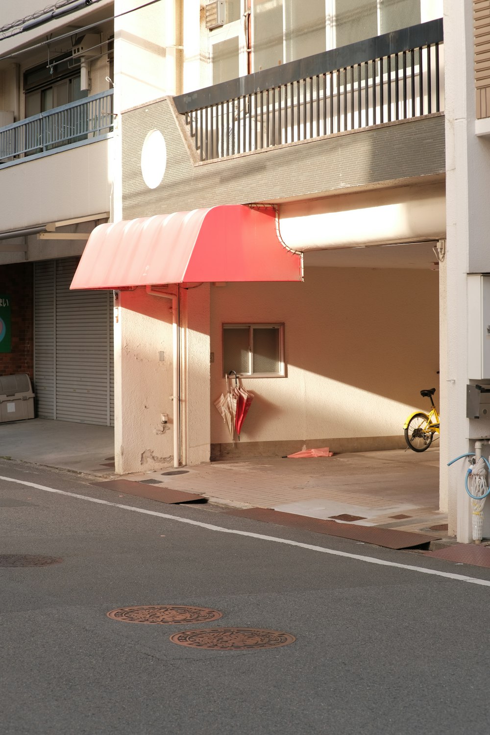 an empty parking garage with a red awning