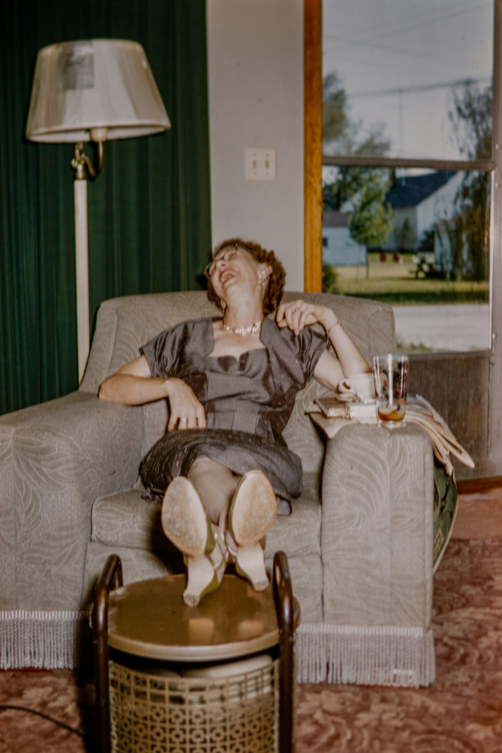 a woman sitting in a chair with her eyes closed