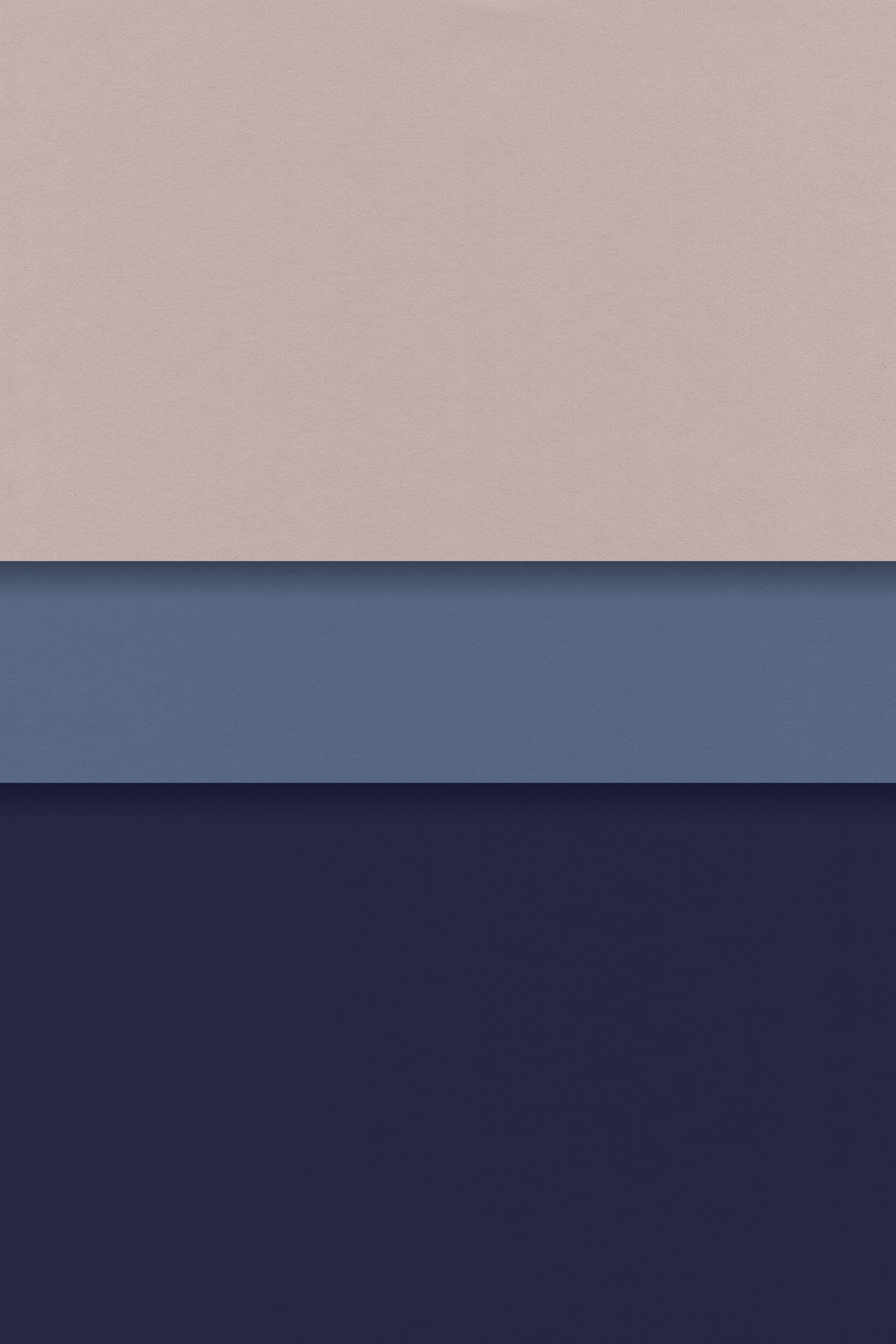 a group of three different colors of paper