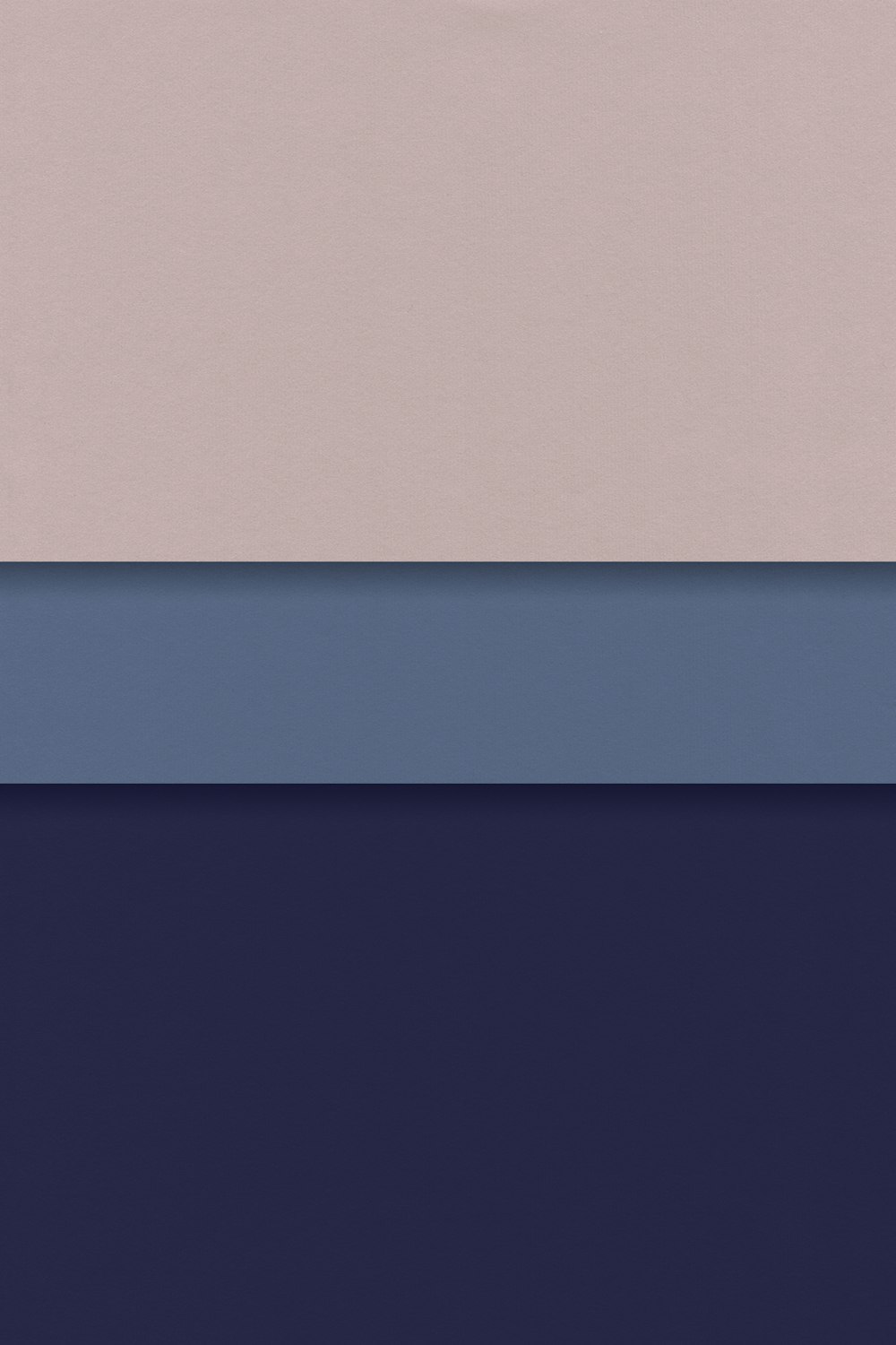 a group of three different colors of paper