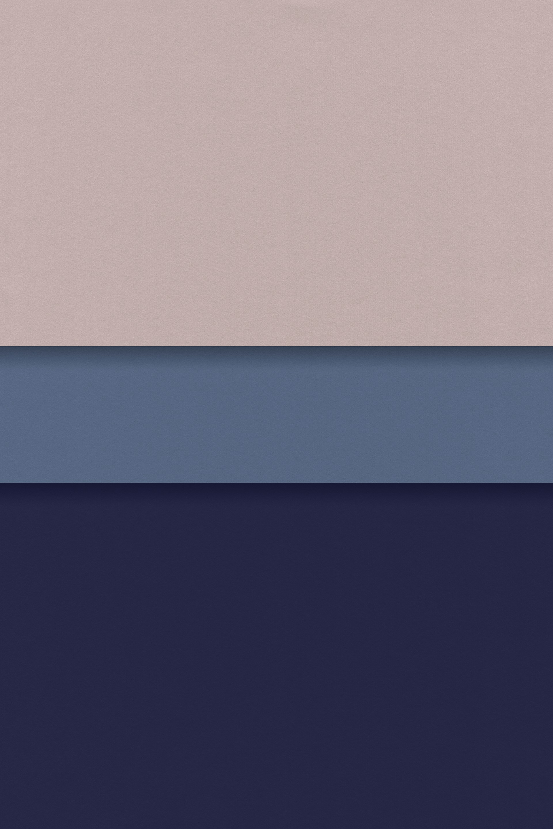 a group of three different colors of paper