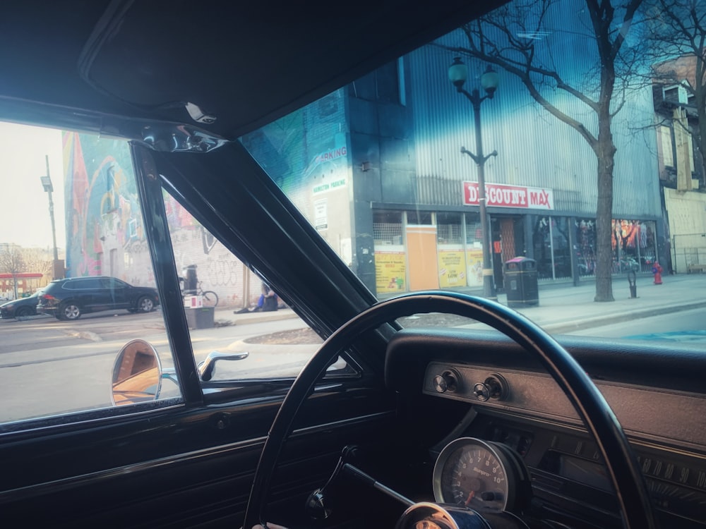 a view of a city street from inside a car