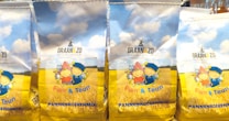 Packages of pancake mix featuring illustrations of two cartoon children in traditional attire against a backdrop of a wheat field and a blue sky with fluffy clouds.
