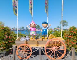 Artistic depiction of children surrounded by iconic cultural symbols like pyramids and classical statues.